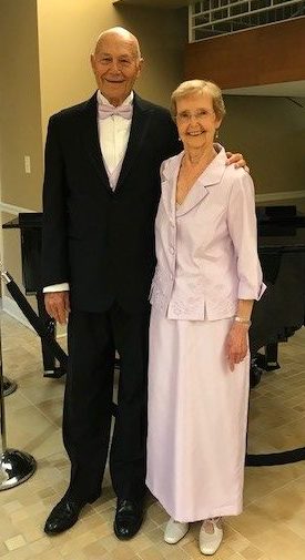 senior couple dressed in formal wear